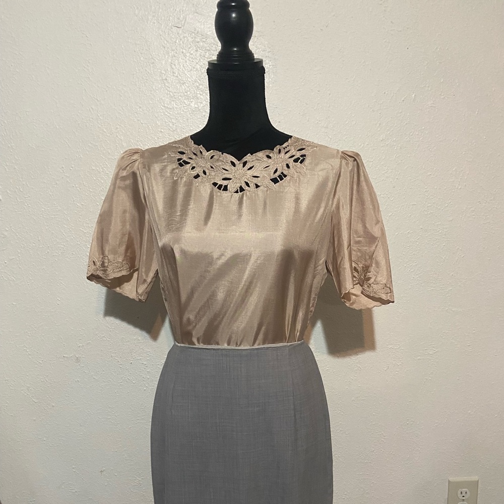 Beautiful tan almost a champagne color blouse with feminine detail.